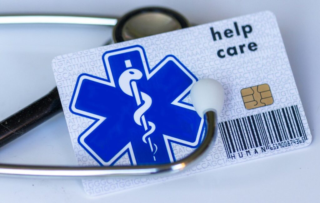A medical card with a stethoscope on top of it